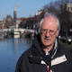 Jan van Waning in front of the canal outside his house that used to freeze over every winter. Image: Max Oprey